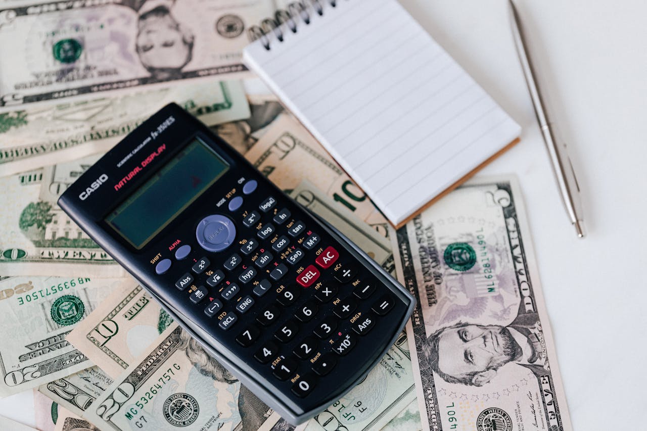 Bills Adding Up With Calculator